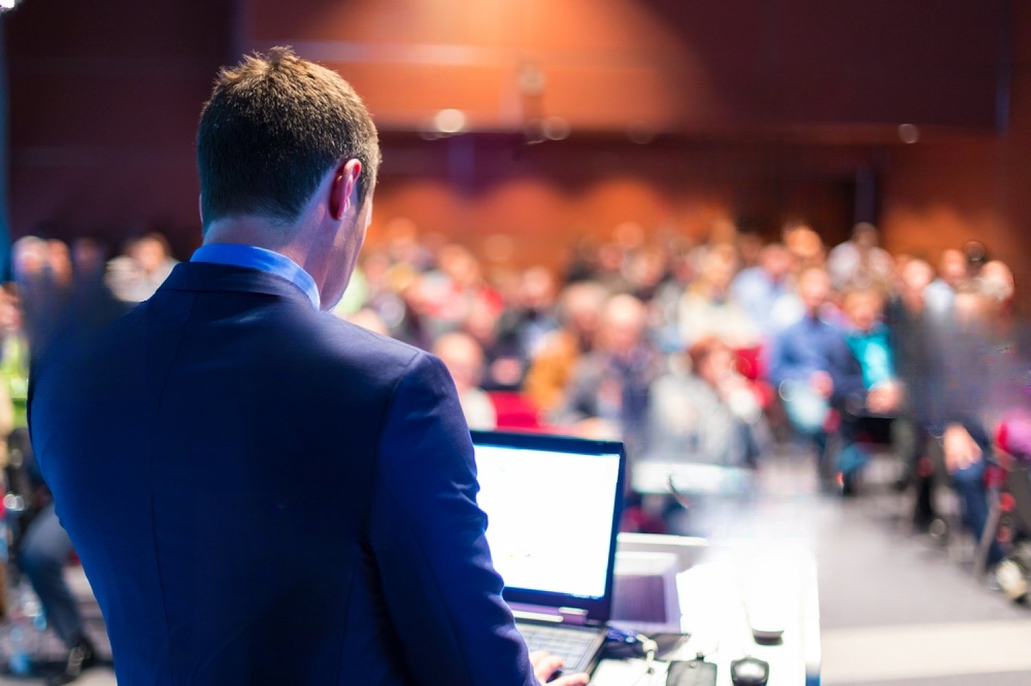 stock-photo-speaker-at-business-conference-and-presentation-audience-at-the-conference-hall-193539209
